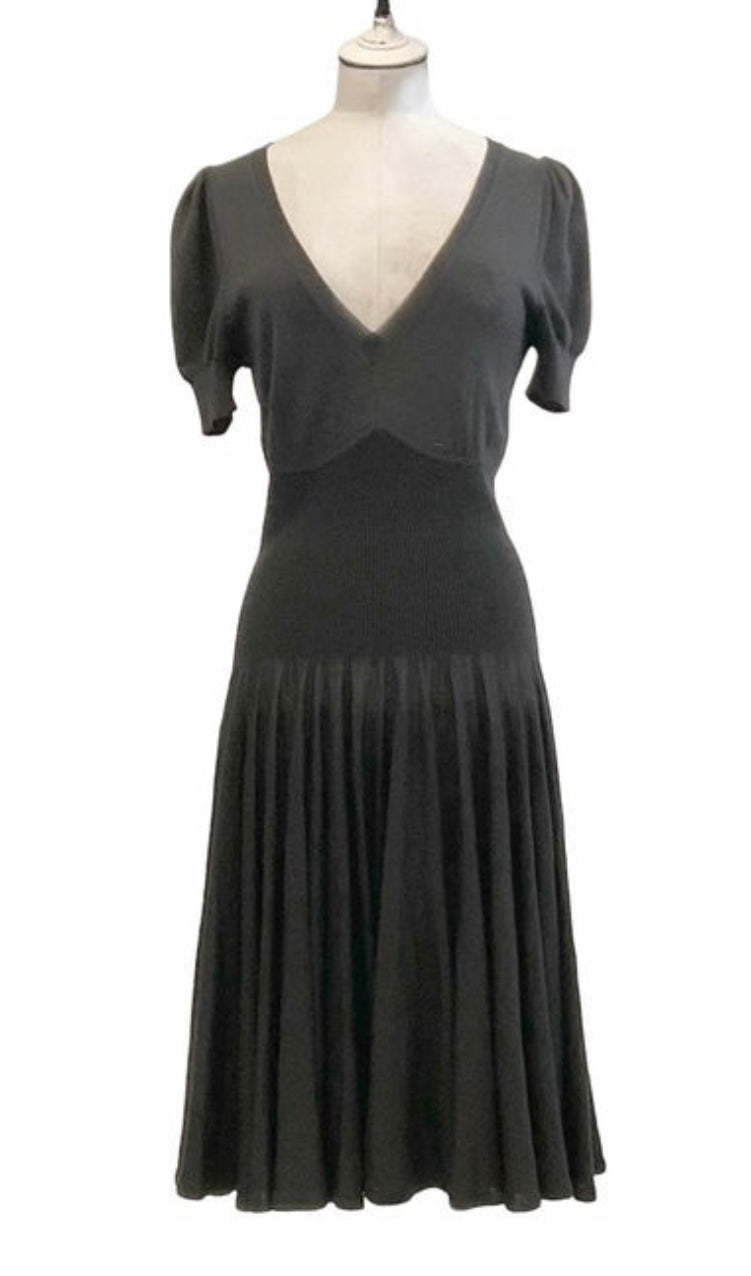 Front view of Alexander McQueen black knit wool midi dress on mannequin.
