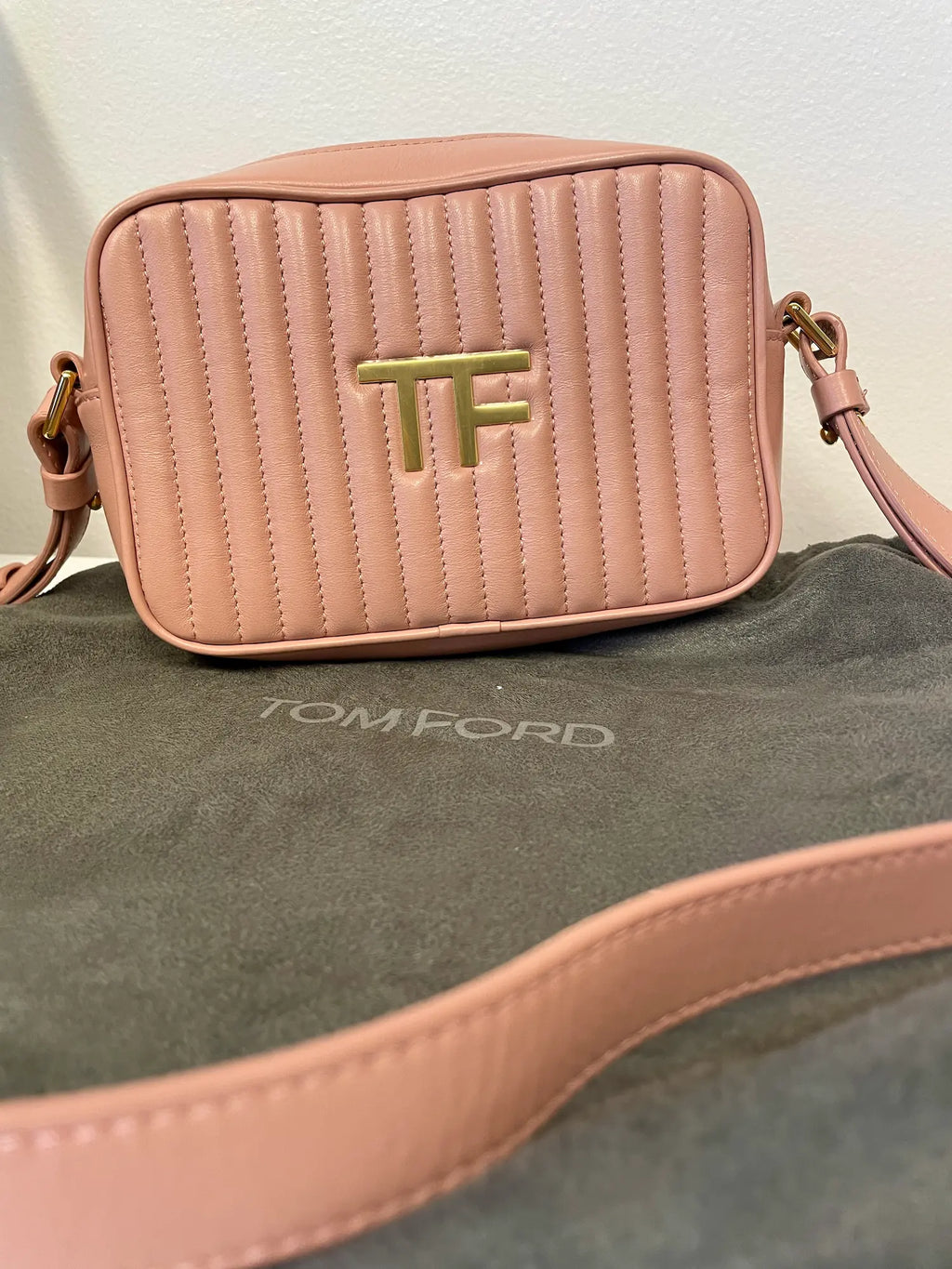 Front angle of Tom Ford blush pink quilted calfskin camera bag.