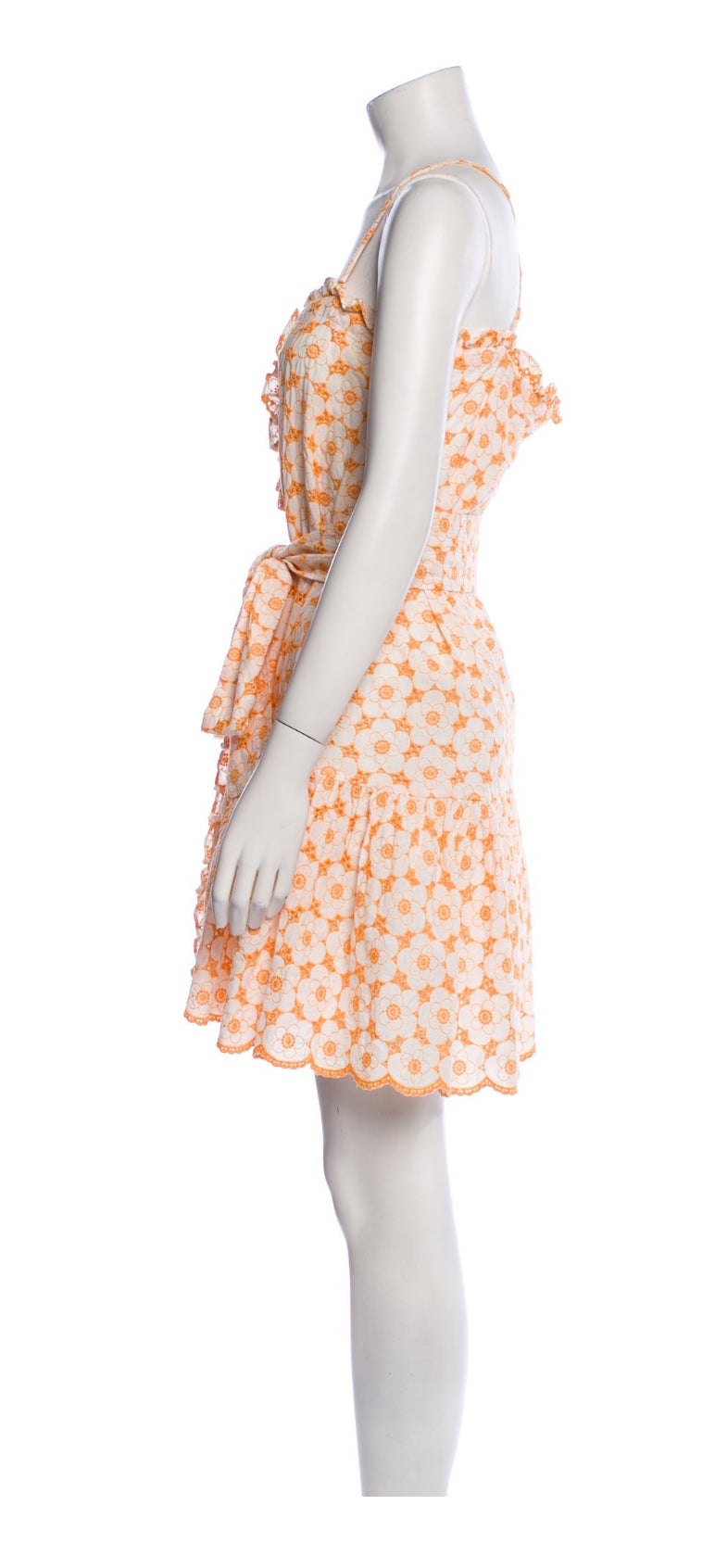 Side view highlighting belted waist and feminine silhouette.