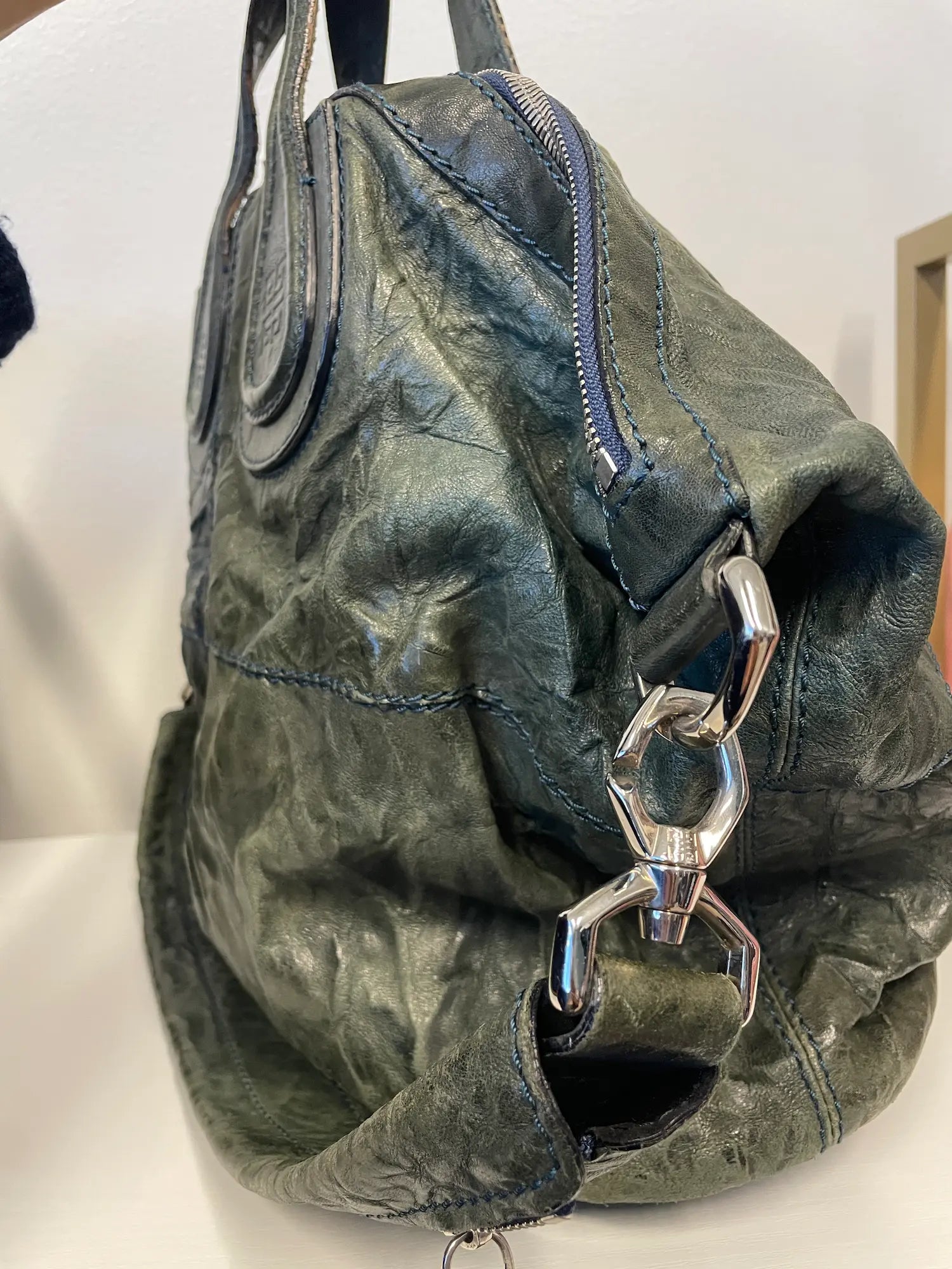 Side profile of Givenchy Nightingale showcasing supple leather texture.