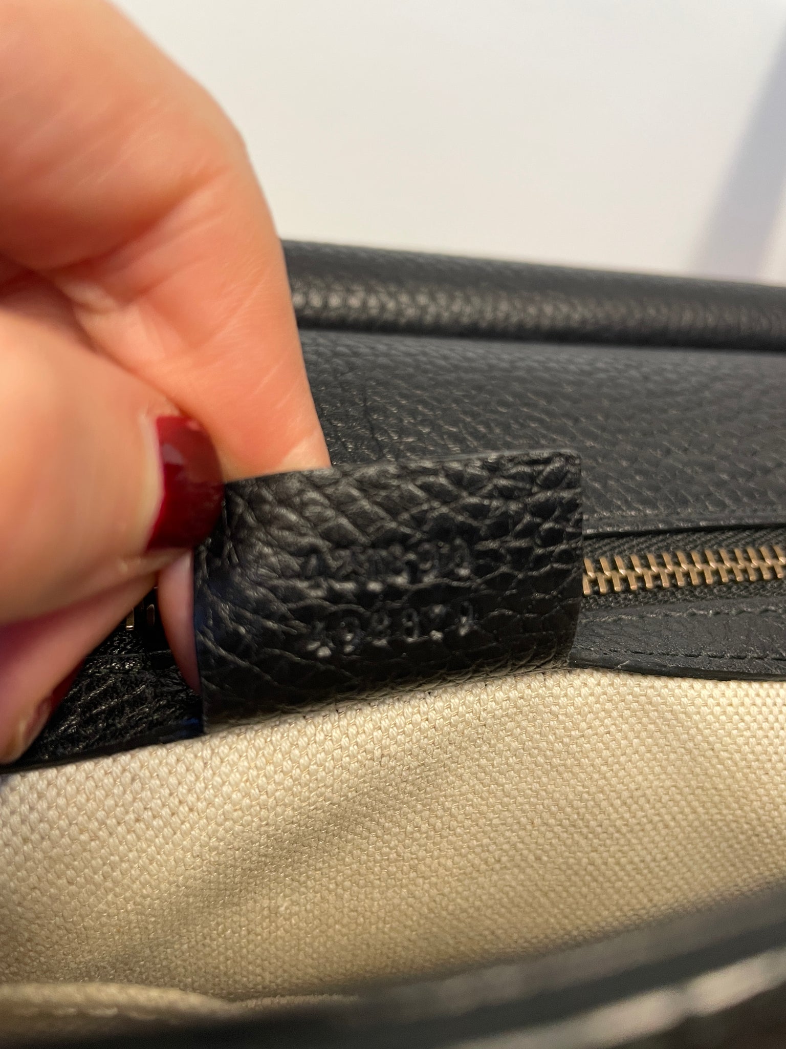 Gucci serial tag and authenticity details inside the Marmont bag.