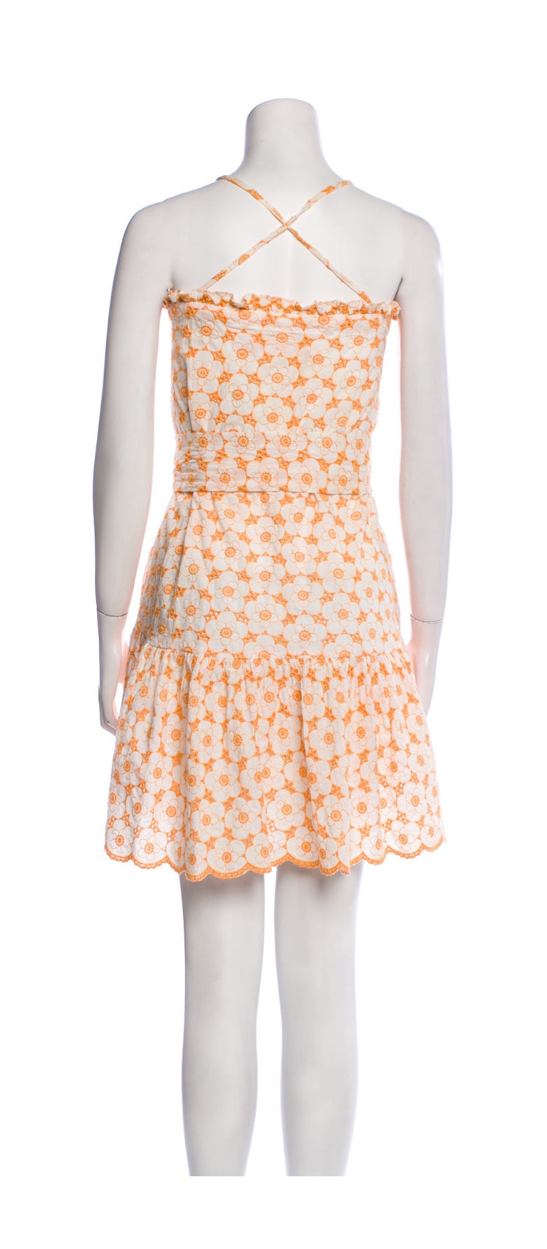 Back view of cotton eyelet mini dress with flared hem.