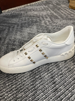 Side profile of Valentino Untitled Rockstud Sneakers – luxury white leather with studs