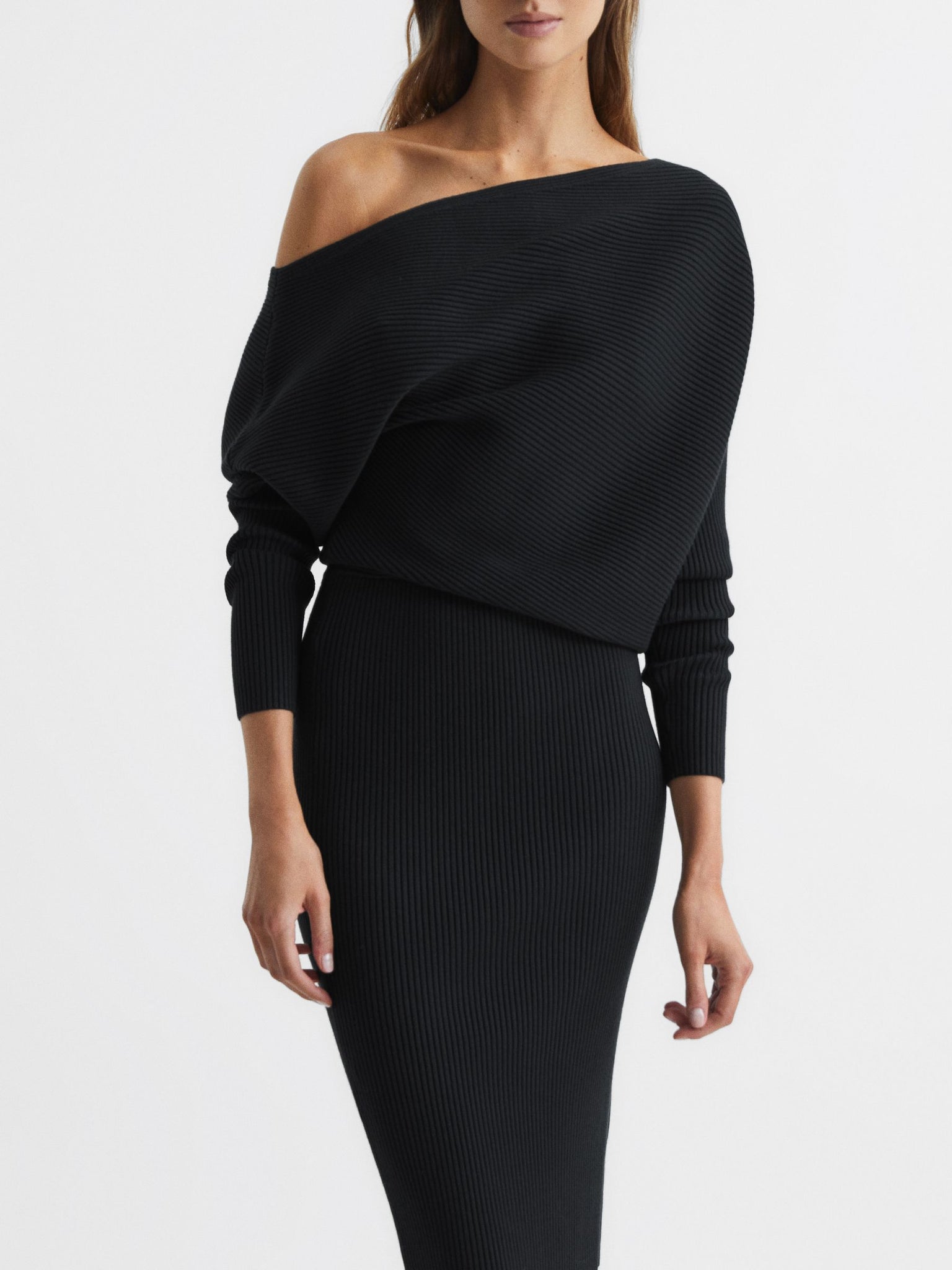 Full-length view of Reiss Lana ribbed knit midi dress in black.