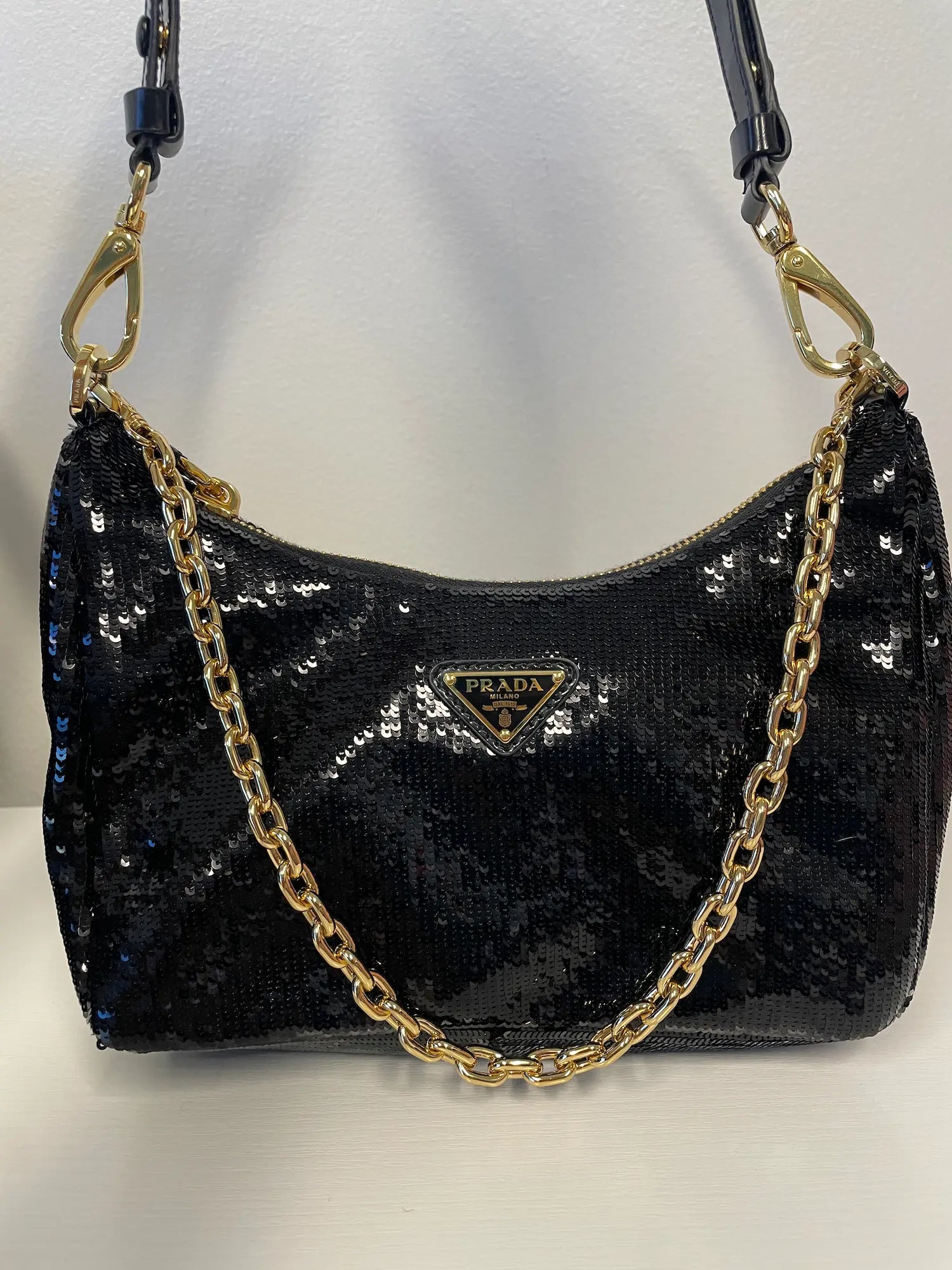 Prada Re-Nylon Sequined Mini Bag in black with chain-link handle.