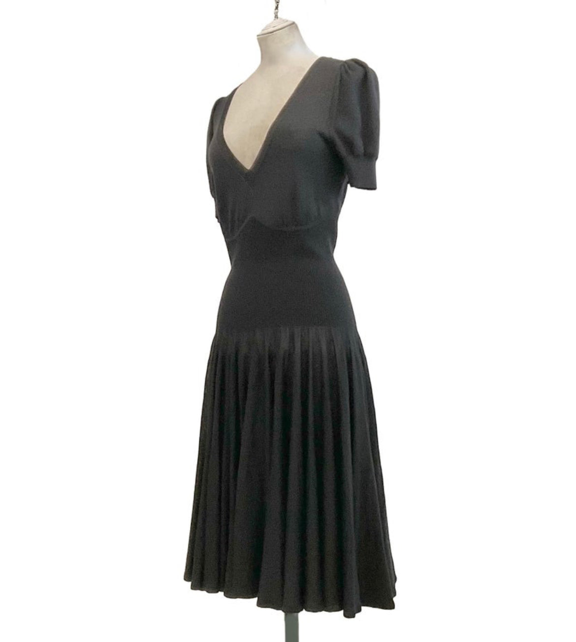 Side view highlighting puff sleeves and fitted waist.