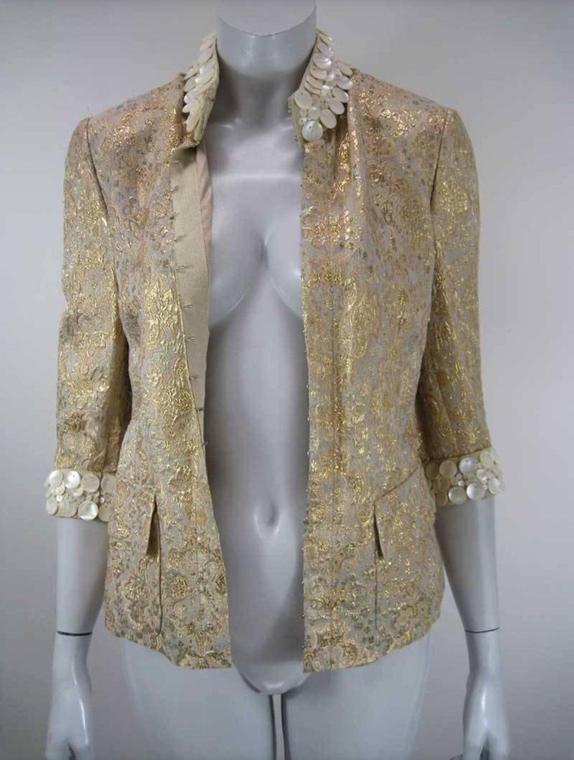 Front view of Dolce & Gabbana gold brocade embellished jacket.