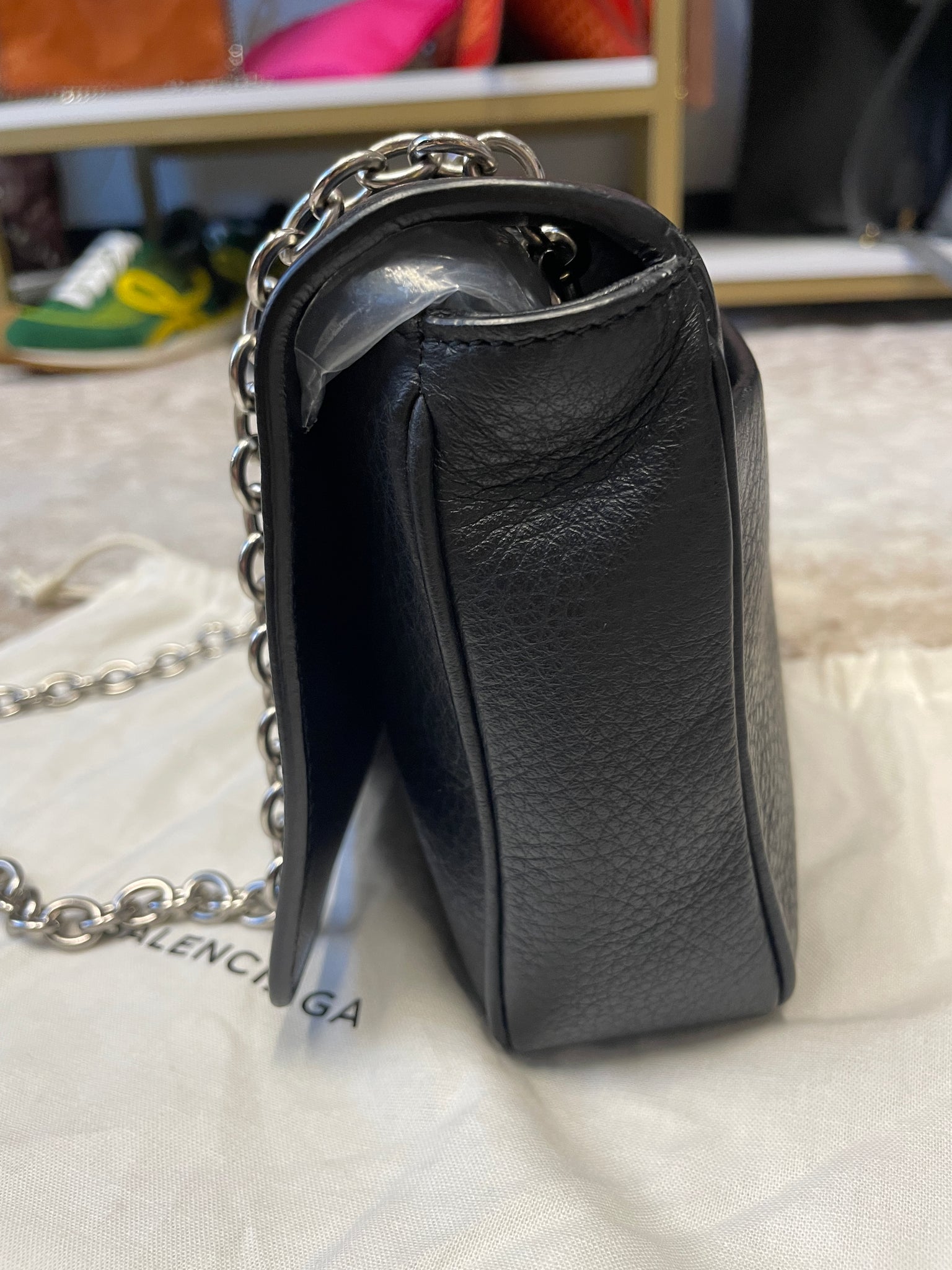 Side view of Balenciaga Everyday Wallet on Chain with graphic print – designer resale