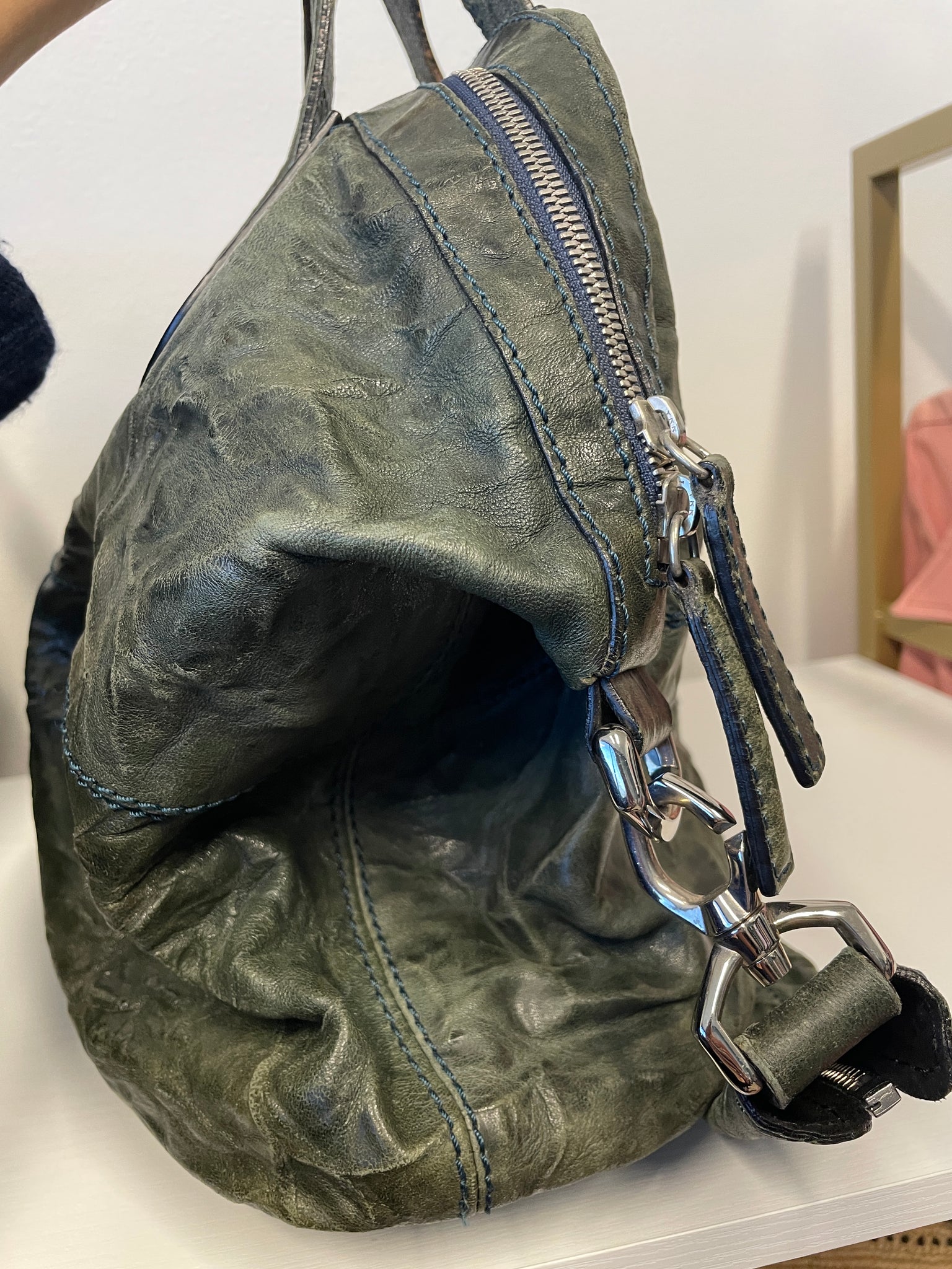 Side profile of Givenchy Nightingale showcasing supple leather texture.