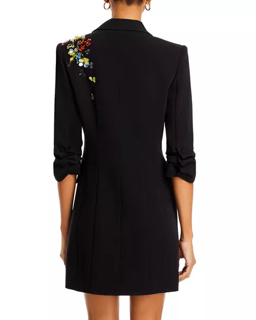 Back view of mini blazer dress highlighting structured fit.