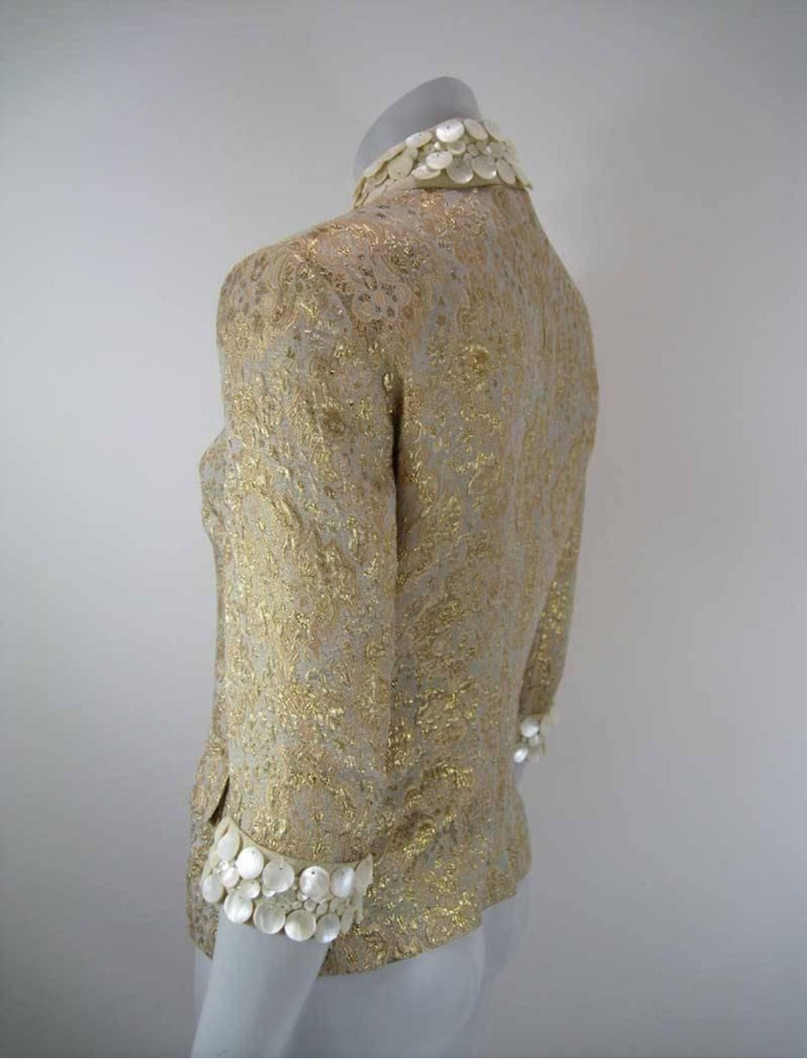Back view showcasing the intricate gold brocade texture.
