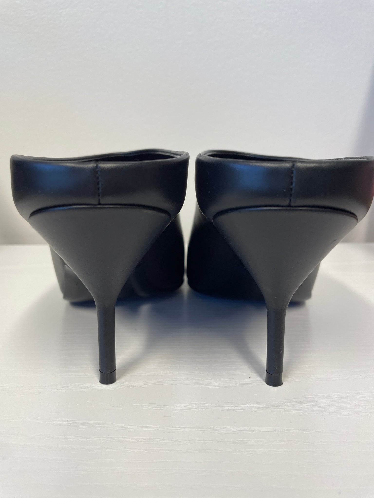 Back angle highlighting sculpted heel design.