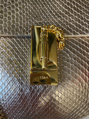 Close-up of Chloé Drew Bag gold hardware and python texture – luxury resale