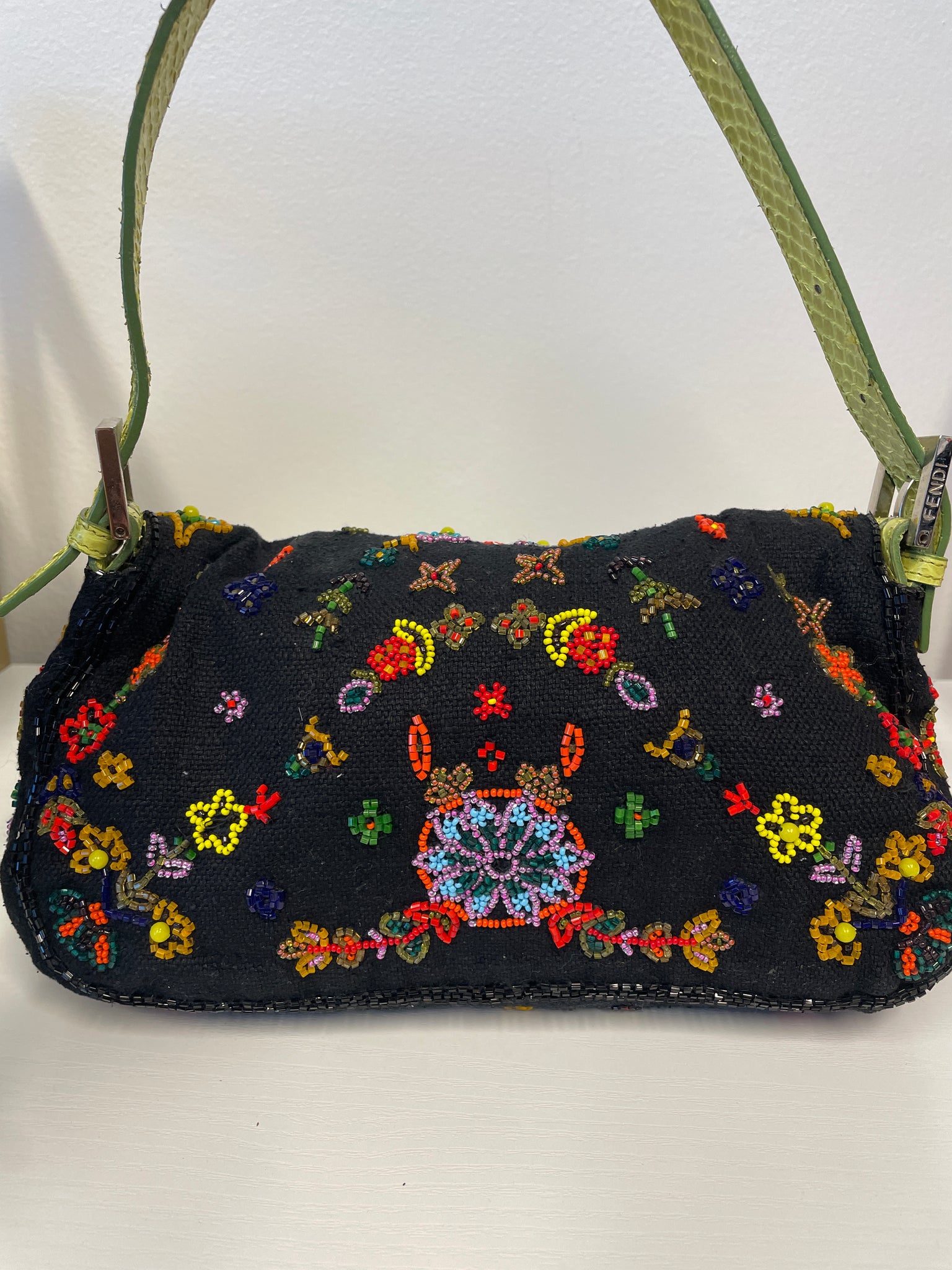 Back view of Fendi python-trimmed baguette handbag.