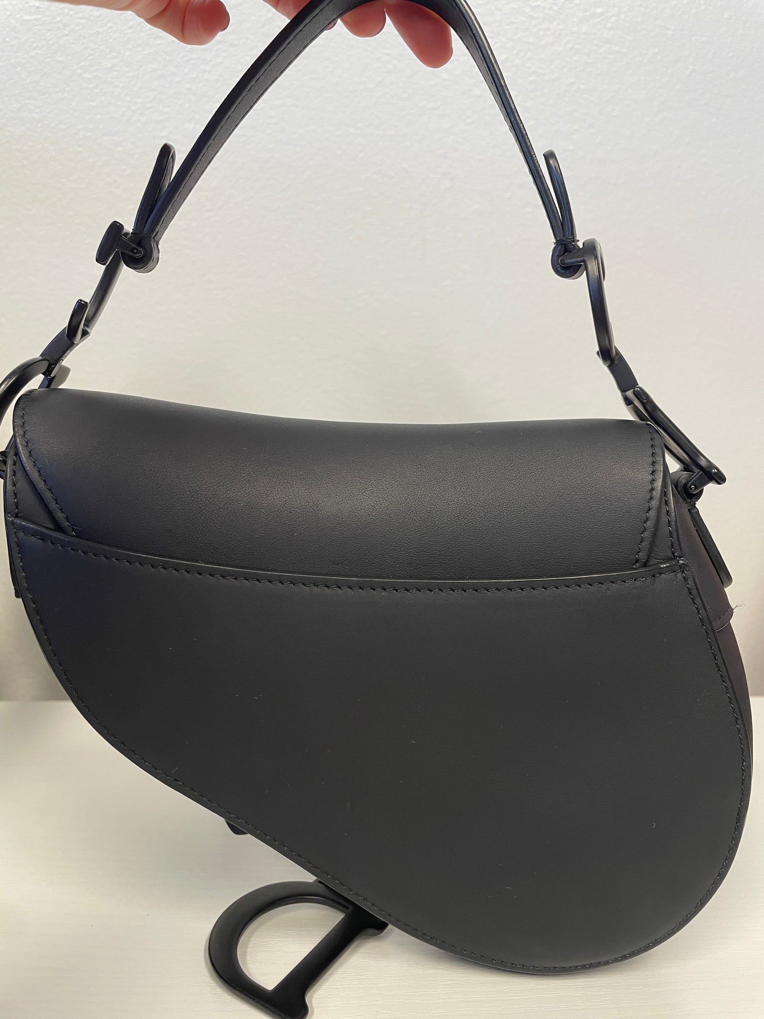 Back view of Dior Saddle Bag in black calfskin.