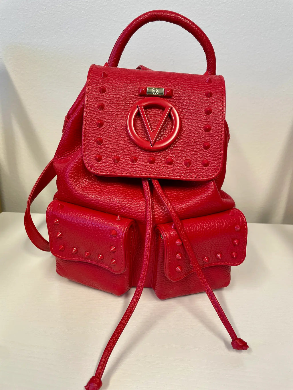 Valentino Rockstud Leather Backpack in red with gold-tone hardware.