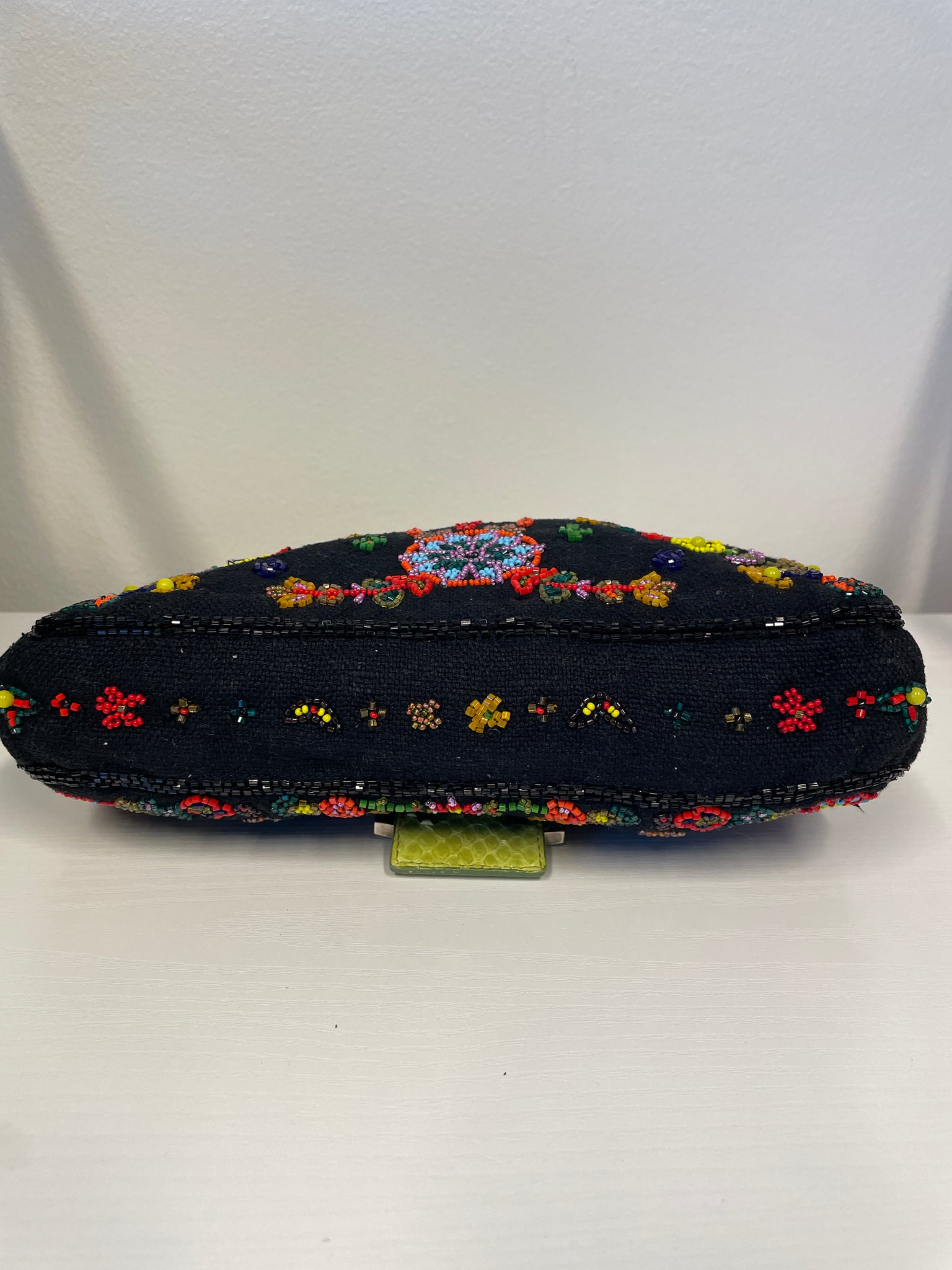 Close-up of Fendi signature buckle and bead embellishments.